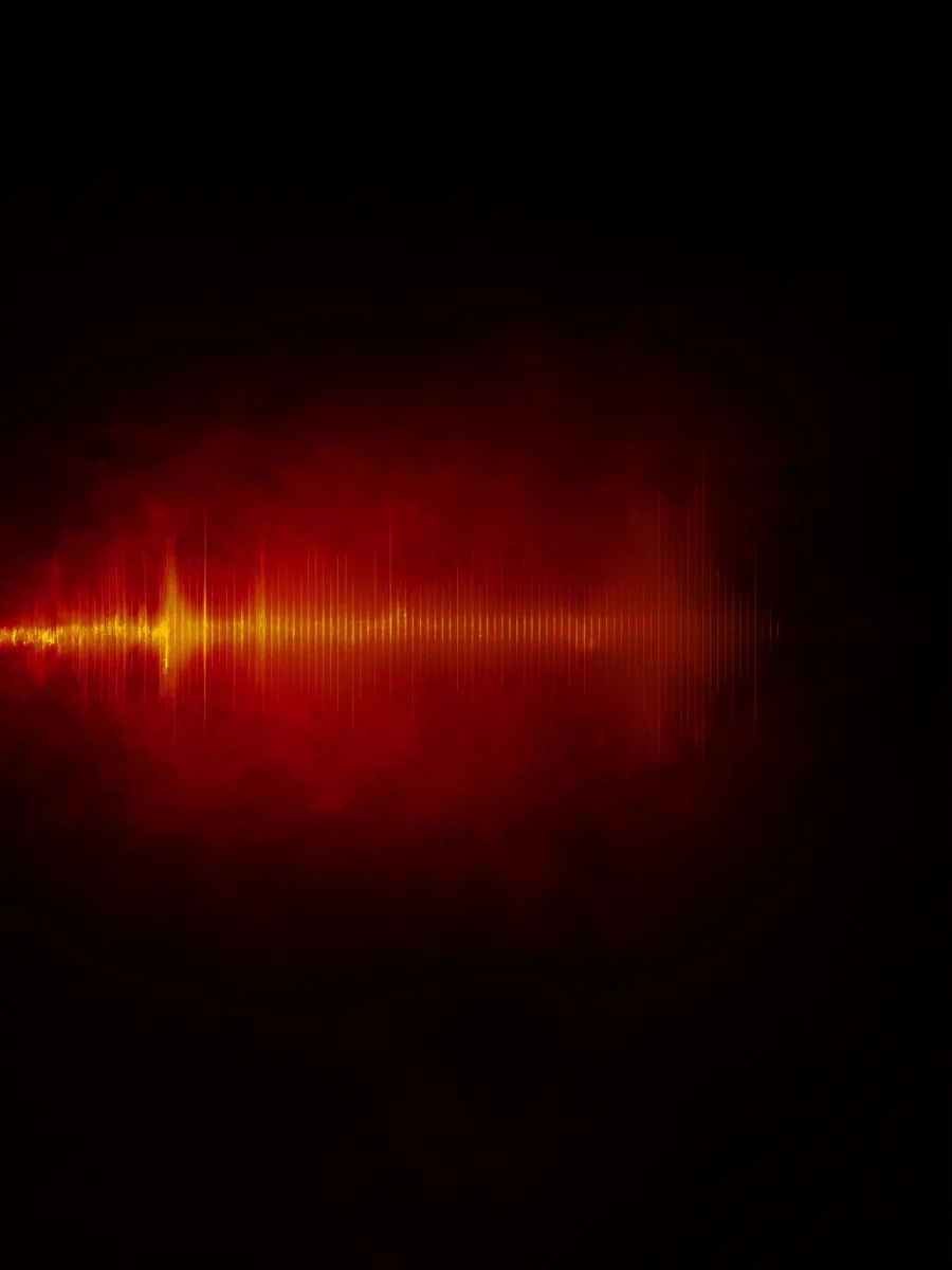 Abstract crimson and copper soundwave cutting through fog